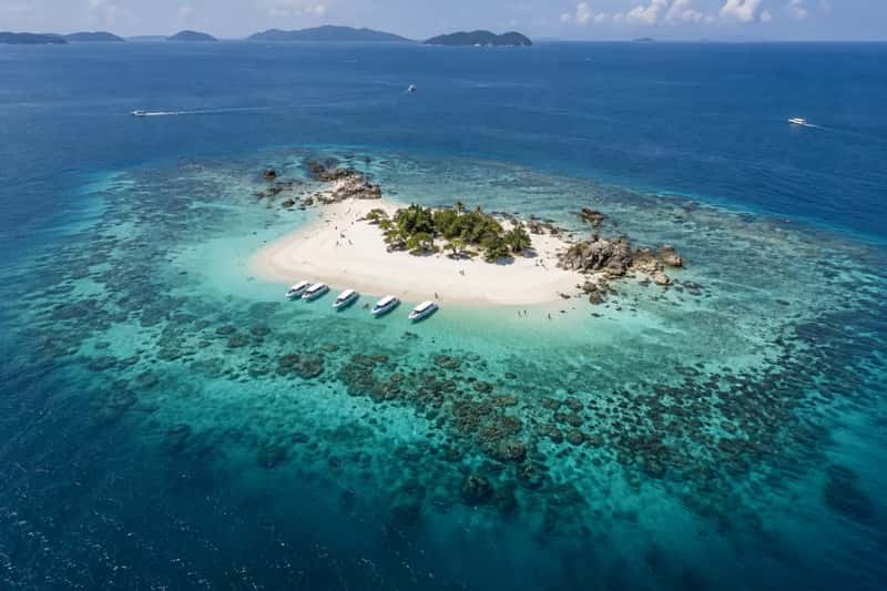 Aerial view of a small Khai island with white sand and turquoise shallows