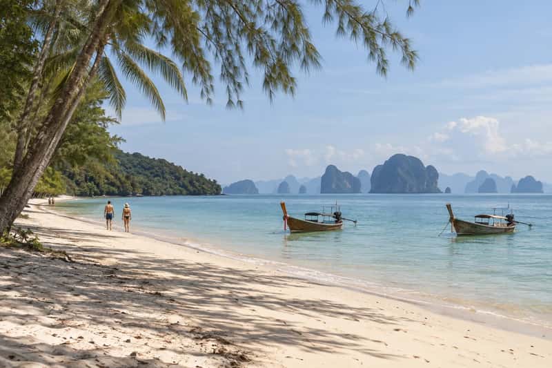Quiet beach on Naka Yai with calm water and views across Phang Nga Bay